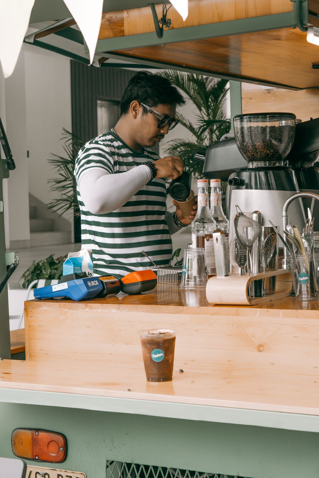 Coffee vendor serving guests at Good Neighbours Market
